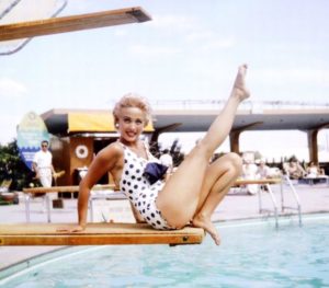 Jane Powell on swimming pool diving board