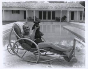 Al Jolson with his dog at his swimming pool