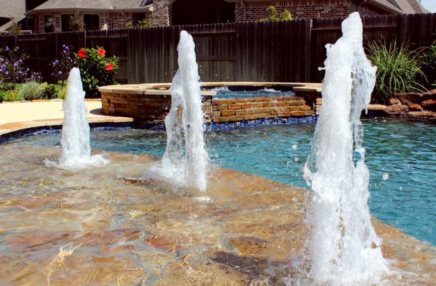Custom Pools in Katy with Gusher water feature