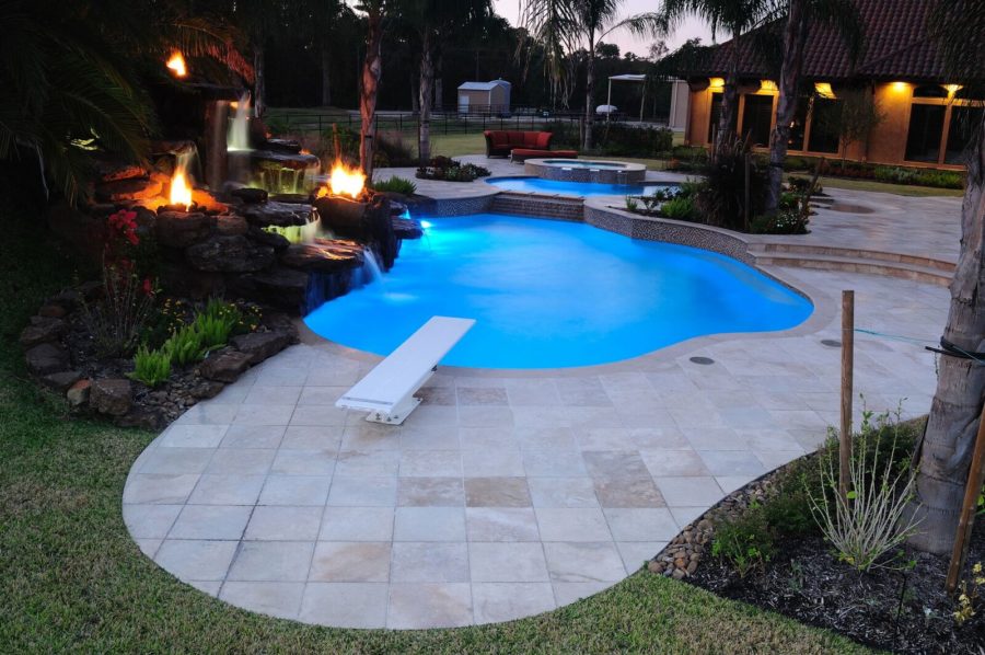 Custom Backyard pool with diving board in Humble TX