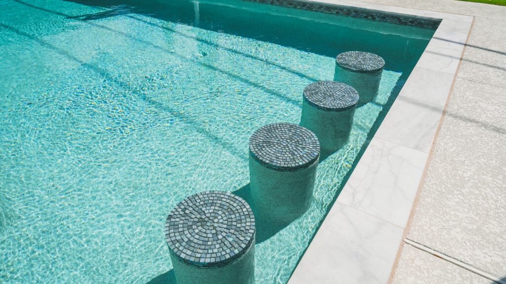 pool with built in bar stools
